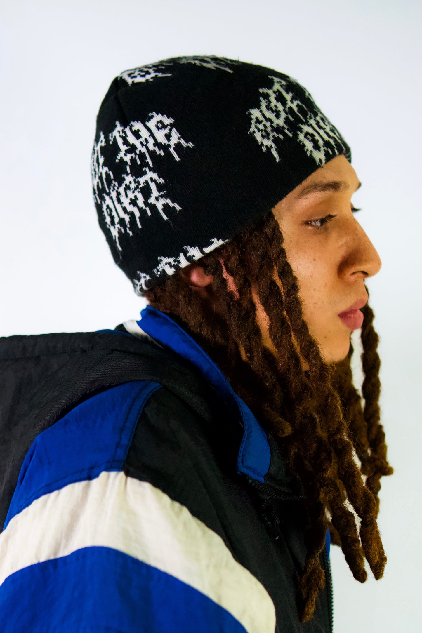 Out The Dirt - Allover Logo Beanie In Black